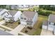 Aerial view of gray two-story home with a driveway and two-car garage in a neighborhood at 908 Adelphia Rd, Fuquay Varina, NC 27526