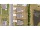 Aerial view of several homes in a neighborhood including a home next to a pond at 908 Adelphia Rd, Fuquay Varina, NC 27526