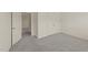 Bedroom with neutral carpet, a closet with double doors, and an open door leading to another room at 908 Adelphia Rd, Fuquay Varina, NC 27526