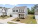 Two-story home with gray siding, black shutters, a driveway, and a two-car garage at 908 Adelphia Rd, Fuquay Varina, NC 27526