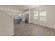 Open-concept kitchen and dining area with stainless steel appliances and wood-look flooring at 908 Adelphia Rd, Fuquay Varina, NC 27526
