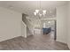 Open-concept living area showcasing the staircase and kitchen, filled with natural light at 908 Adelphia Rd, Fuquay Varina, NC 27526