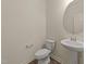 Clean powder room featuring a pedestal sink, modern fixtures, and tiled floors at 908 Adelphia Rd, Fuquay Varina, NC 27526