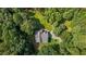 Aerial view of home surrounded by lush greenery and a circular drive at 92 Summer Dawn, Pittsboro, NC 27312