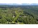 Expansive acreage including the home surrounded by dense forestry at 92 Summer Dawn, Pittsboro, NC 27312