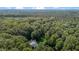 Aerial view of the property and surrounding trees and foliage at 92 Summer Dawn, Pittsboro, NC 27312