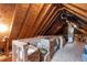 Spacious attic providing ample storage space with exposed beams at 92 Summer Dawn, Pittsboro, NC 27312