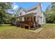 Inviting back deck perfect for entertaining or relaxing, overlooks a private backyard space at 92 Summer Dawn, Pittsboro, NC 27312
