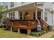 The wooden back deck provides outdoor living space and a place to sit outside at 92 Summer Dawn, Pittsboro, NC 27312