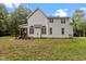 Rear view of home showcasing the siding, windows, and expansive yard at 92 Summer Dawn, Pittsboro, NC 27312