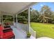 Spacious back porch offering an outdoor retreat with views of the expansive, green lawn at 92 Summer Dawn, Pittsboro, NC 27312