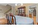Dining area features a wooden china cabinet and hardwood floors at 92 Summer Dawn, Pittsboro, NC 27312