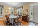 Elegant dining room with natural light, traditional furnishings, and hardwood floors at 92 Summer Dawn, Pittsboro, NC 27312