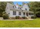 Charming home with manicured landscaping, covered porch, and inviting curb appeal at 92 Summer Dawn, Pittsboro, NC 27312
