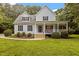 Beautiful home with a classic design, well-maintained lawn, and welcoming front porch at 92 Summer Dawn, Pittsboro, NC 27312