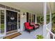 Inviting front porch featuring comfortable seating and a welcoming entrance with a decorative wreath at 92 Summer Dawn, Pittsboro, NC 27312