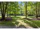 Spacious front yard with mature shade trees surrounds this idyllic home at 92 Summer Dawn, Pittsboro, NC 27312