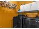 Well-lit laundry room with high-end washer and dryer, upper cabinets, and ample storage space on shelves at 92 Summer Dawn, Pittsboro, NC 27312