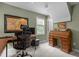Functional home office with ceiling fan, desk, and comfortable ergonomic chair at 92 Summer Dawn, Pittsboro, NC 27312