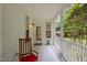 Cozy side porch with a rocking chair, perfect for relaxing and enjoying the outdoor scenery at 92 Summer Dawn, Pittsboro, NC 27312