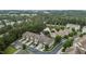 A townhouse community with mature trees and a pond at 9302 Nellman Ln, Raleigh, NC 27617