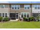A patio with a screen door, BBQ, landscaping, and grassy backyard at 9302 Nellman Ln, Raleigh, NC 27617