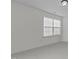 Empty bedroom with neutral carpet, paint, window, and fixtures is ready to customize as you like at 9302 Nellman Ln, Raleigh, NC 27617