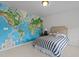 Fun bedroom with map mural and stylish striped bed, creating an adventurous and cozy space at 9302 Nellman Ln, Raleigh, NC 27617