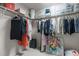 Well-organized walk-in closet with hanging clothes, shelving, and ample storage solutions at 9302 Nellman Ln, Raleigh, NC 27617