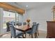 Inviting dining room features wood table, upholstered chairs, and access to the outdoor patio at 9302 Nellman Ln, Raleigh, NC 27617