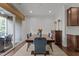 Bright dining room with hardwood floors, wood table, seating for six, and sliding glass doors at 9302 Nellman Ln, Raleigh, NC 27617