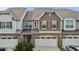 The front of a two-story townhome with a two car garage at 9302 Nellman Ln, Raleigh, NC 27617
