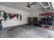 A spacious garage with storage racks, hooks, and overhead lighting at 9302 Nellman Ln, Raleigh, NC 27617