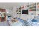 Stylish living room with custom shelving, plush seating, and hardwood floors at 9302 Nellman Ln, Raleigh, NC 27617