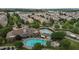 Aerial view of a community pool with lounge chairs and tables at 9302 Nellman Ln, Raleigh, NC 27617