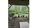 View of a green backyard with garden plants beneath an outdoor structure at 1005 Lathrop Ln, Apex, NC 27523