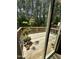 Wooden deck surrounded by lush trees, offering a serene outdoor space for relaxation and entertaining at 1005 Lathrop Ln, Apex, NC 27523