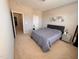 Inviting bedroom with a gray bed, mirrored nightstands, and neutral walls, offering a relaxing atmosphere at 1005 Lathrop Ln, Apex, NC 27523
