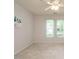 Bright bedroom with plush carpet, ceiling fan, and natural light from two windows at 101 Lake Tillery Dr, Cary, NC 27519