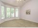 This bedroom is filled with natural light and features vaulted ceilings at 101 Lake Tillery Dr, Cary, NC 27519
