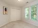 This bedroom is a serene space with carpet flooring, neutral walls, and natural light at 101 Lake Tillery Dr, Cary, NC 27519