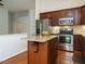 Well-equipped kitchen with stainless steel appliances, hardwood floors, and a central island for cooking and entertaining at 101 Lake Tillery Dr, Cary, NC 27519