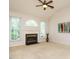 Bright living room features vaulted ceilings, a fireplace, and large windows at 101 Lake Tillery Dr, Cary, NC 27519