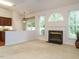 Open floor plan living room with fireplace and view into the kitchen at 101 Lake Tillery Dr, Cary, NC 27519