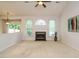 Cozy living room with fireplace, vaulted ceilings, and abundant natural light at 101 Lake Tillery Dr, Cary, NC 27519