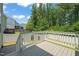Spacious back deck, complete with white railings and stairs to the yard at 1013 Poppy Fields Ln, Wake Forest, NC 27587