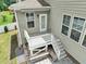 Exterior view of the back porch featuring stairs and a patio, offering a relaxing outdoor space at 1013 Poppy Fields Ln, Wake Forest, NC 27587