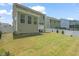 Expansive backyard featuring lush green grass, and partial privacy fence at 1013 Poppy Fields Ln, Wake Forest, NC 27587