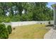 Well-manicured backyard featuring lush green grass and white privacy fence at 1013 Poppy Fields Ln, Wake Forest, NC 27587