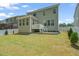 Spacious backyard with lush lawn, privacy fence, and a patio perfect for outdoor entertaining at 1013 Poppy Fields Ln, Wake Forest, NC 27587